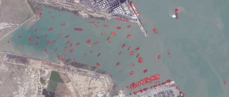 Satellite imagery of ships and tankers at anchor near a port